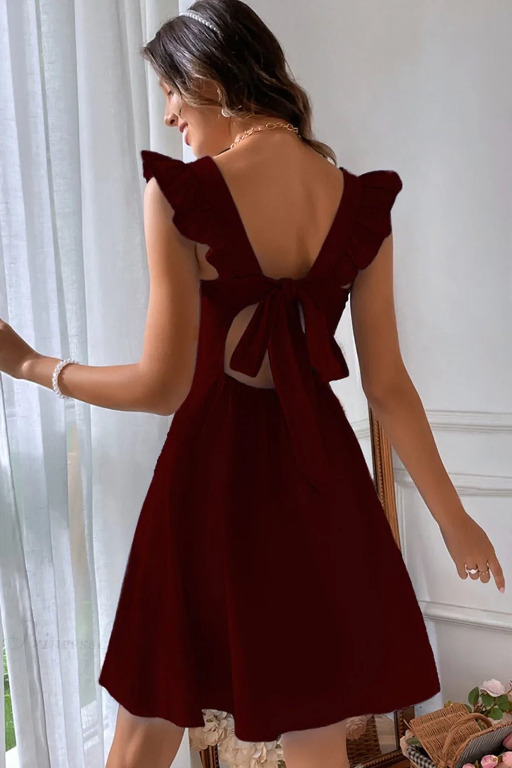 Nora Sleeveless Mini Dress with Ruffle Tie-back